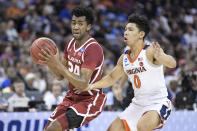 Oklahoma guard Jamal Bieniemy (24) drives to the hoop against Virginia guard Kihei Clark (0) during the first half of a second-round game in the NCAA men's college basketball tournament Sunday, March 24, 2019, in Columbia, S.C. (AP Photo/Sean Rayford)