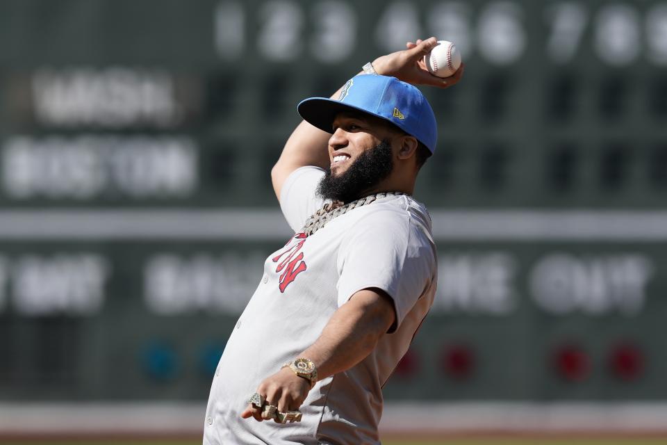 Dominican rapper El Alfa El Jefe throws a ceremonial first pitch before baseball game between the Boston Red Sox and the Washington Nationals, Saturday, May 11, 2024, in Boston. (AP Photo/Michael Dwyer)