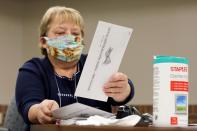 Absentee ballots are counted during the presidential primary election in Wisconsin