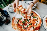 <p>OK, it's true: The greasy dollar-slice pizza down the block is not even close to the picture of health. But all pizza is not created equal, friends. "Pizza can be loaded with fat and calories, but it doesn't have to be!" Donna Rose, registered dietitian of <a href="http://www.nonasnutritionnotes.com/" rel="nofollow noopener" target="_blank" data-ylk="slk:Nona's Nutrition Notes;elm:context_link;itc:0;sec:content-canvas" class="link ">Nona's Nutrition Notes</a>, tells Delish. How can you make it a better option? Rose says to make your own pizza with a thin crust, topped with lots of veggies, tomatoes, and low-fat cheese. "Tomatoes provide Vitamins A and C, as well as potassium, phosphorous, folic acid, beta-carotene, and a host of other beneficial nutrients." </p>