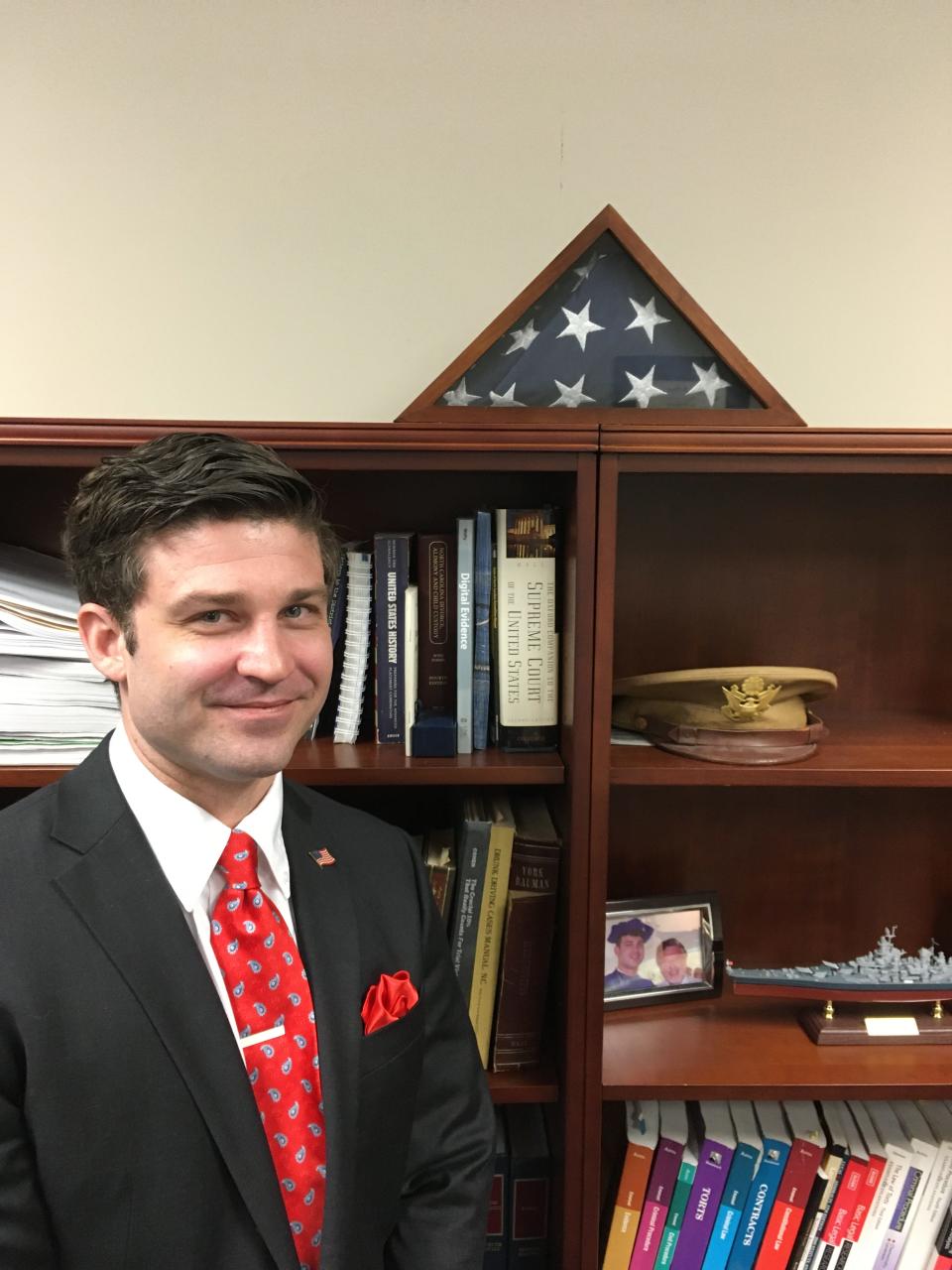 Superior Court Judge Jesse Caldwell IV poses in his office next to a treasured American flag.