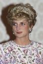 <p>At a state dinner in Seoul, South Korea with curled ends under her diamond tiara. </p>