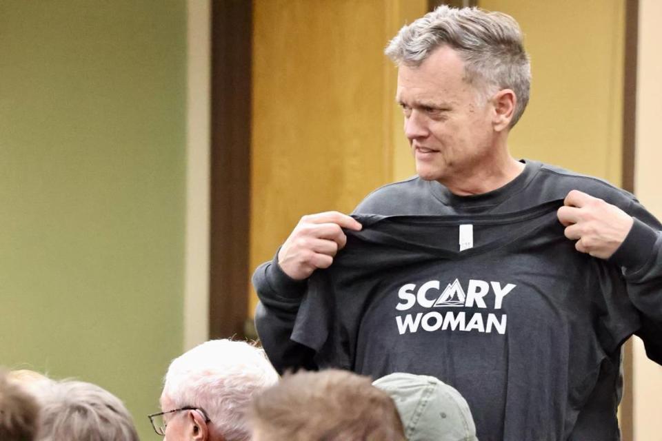 Coeur d’Alene City Councilman Dan Gookin, seen here holding a T-shirt before a North Idaho College meeting, has become a fiery critic of Kootenai County Republican leadership. (Duane Rasmussen photo)