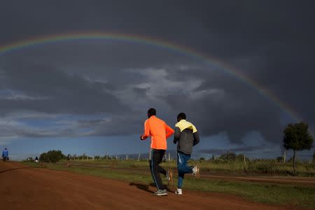 Athletes run during a training session near the town of Iten in western Kenya, November 12, 2015. REUTERS/Siegfried Modola