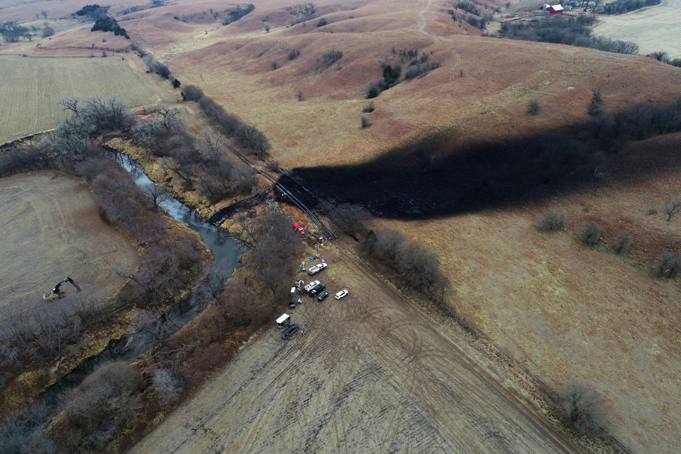 FILE - In this photo taken by a drone, cleanup continues in the area where the ruptured Keystone pipeline dumped oil into a creek in Washington County, Kan., Friday, Dec. 9, 2022. The Environmental Protection Agency announced Monday, Jan., 9, 2023, that it has reached an agreement with a pipeline operator to clean up a spill that dumped 14,000 bathtubs’ worth of crude oil into a rural Kansas creek. (DroneBase via AP, File)