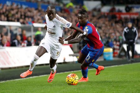 Football - Swansea City v Crystal Palace - Barclays Premier League - Liberty Stadium - 6/2/16 Crystal Palace's Papa Soure and Swansea's Modou Barrow Mandatory Credit: Action Images / Paul Childs Livepic