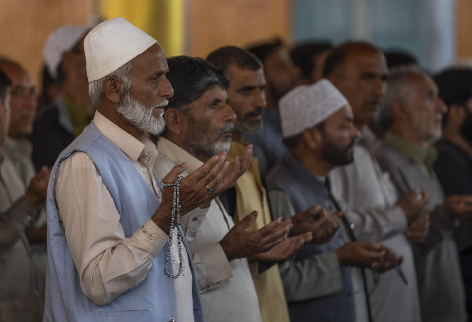 FILE- Kashmiris pray for Palestinians killed in Israel's military operations in Gaza, inside a mosque in Budgham, northeast of Srinagar, Indian controlled Kashmir, Oct. 13, 2023. In Indian-controlled Kashmir, known for its vocal pro-Palestinian stance, authorities have barred any solidarity protest and asked Muslim preachers not to mention the conflict in their sermons. Analysts say the new restrictions on speech reflect a shift in India’s foreign policy under the populist Prime Minister Narendra Modi away from its long-held support for the Palestinians. (AP Photo/ Dar Yasin, File)