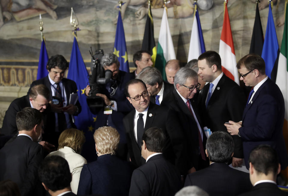 French President Francois Hollande, center, gathers with other EU leaders after signing a declaration during an EU summit meeting at the Orazi and Curiazi Hall in the Palazzo dei Conservatori in Rome on Saturday, March 25, 2017. European Union leaders were gathering in Rome to mark the 60th anniversary of their founding treaty and chart a way ahead following the decision of Britain to leave the 28-nation bloc. (AP Photo/Alessandra Tarantino)