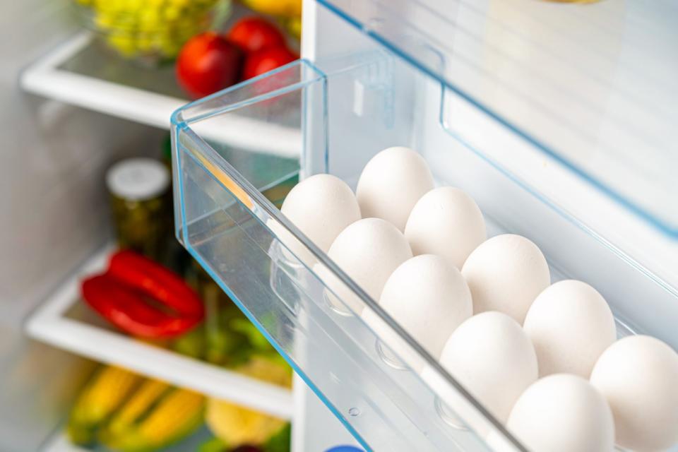 Pack of eggs on a fridge shelf
