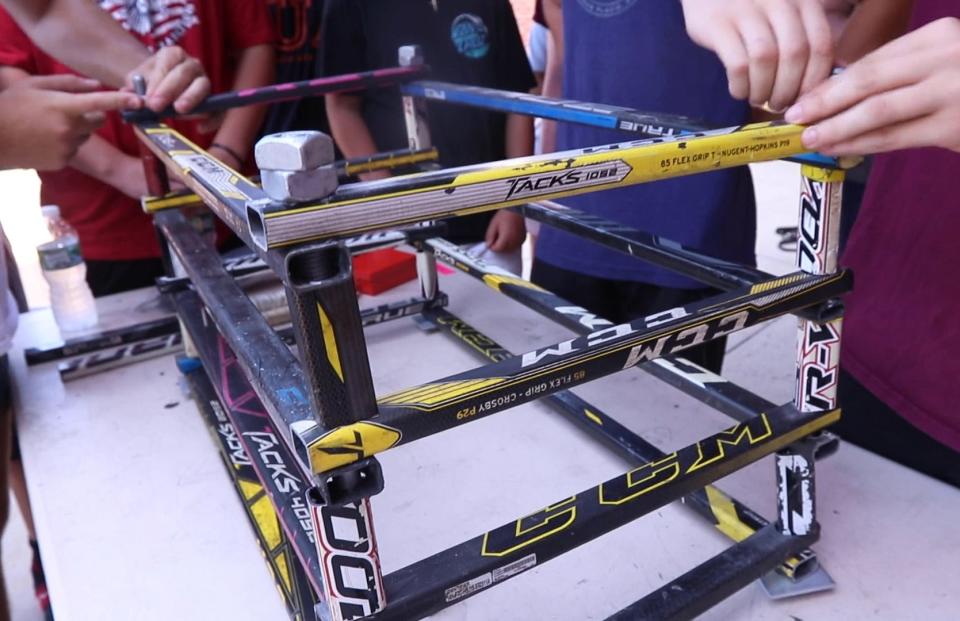 Members of the Central Regional hockey team make oyster reefs from recycled hockey sticks. The environmental group NY/NJ Baykeeper has collected donated hockey sticks and partnered with Central Regional High School to construct oyster reefs.  Bayville, NJWednesday, July 20, 2022