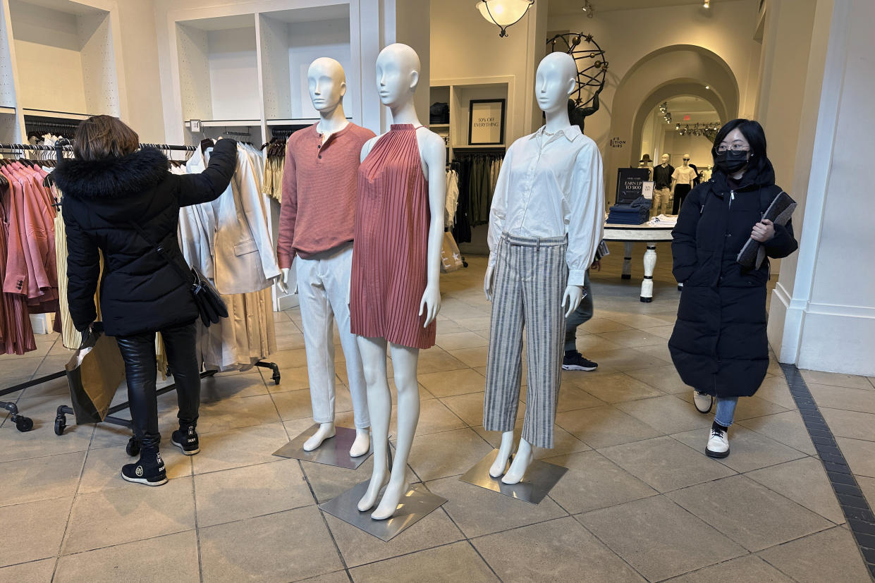 People shop at a clothing store in midtown Manhattan in New York on Tuesday, March 19, 2024. (AP Photo/Ted Shaffrey)