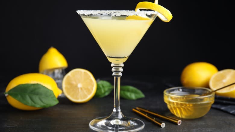 Lemon and honey behind cocktail