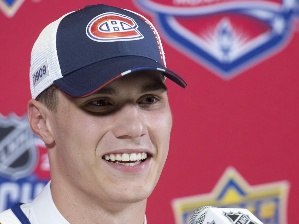 Juraj Slafkovsky smiles during a news conference after being selected as the first overall pick by the Montreal Canadiens during the first round of the NHL hockey draft in Montreal, Thursday, July 7, 2022. (Graham Hughes/The Canadian Press via AP)