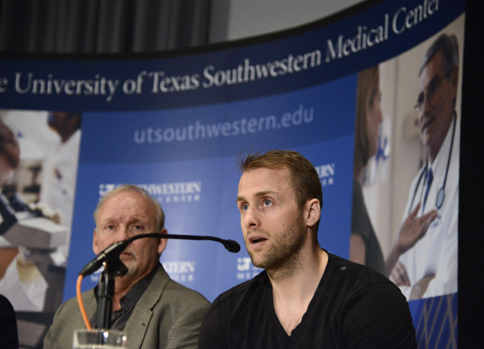 FILE - Dallas Stars forward Rich Peverley, right, makes a statement regarding his health and the incident which occurred in an NHL game during a news conference at UT Southwestern Medical Center as coach Lindy Ruff looks on March 12, 2014, in Dallas. The horror that swept across the NFL when Buffalo Bills defensive back Damar Hamlin collapsed and went into cardiac arrest during a game this week in Cincinnati was all too familiar to members of the hockey community. (AP Photo/Tim Sharp, File)