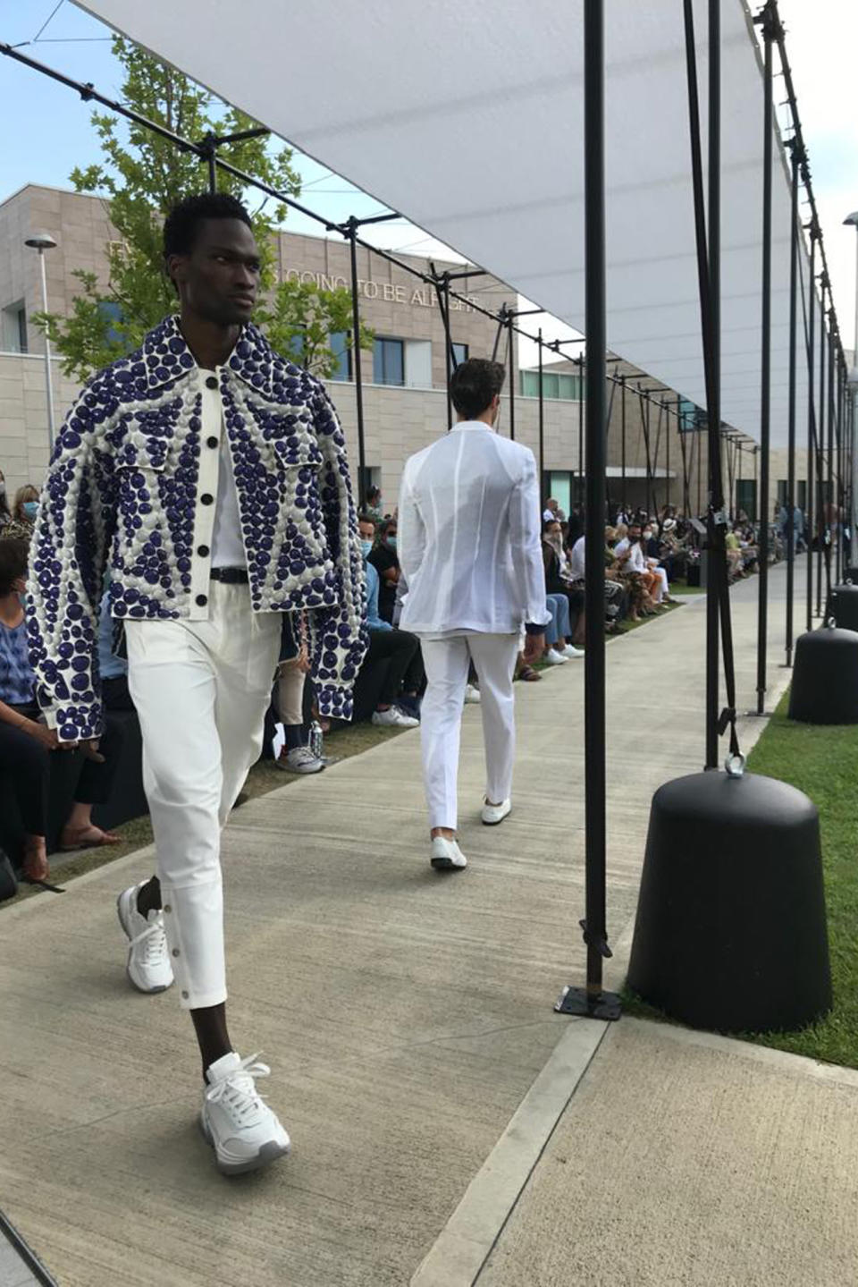 A model wears a creation as part of Dolce&Gabbana men's Spring-Summer 2021 collection, presented in Milan, Italy, Wednesday, July 15, 2020. (AP Photo/Colleen Barry)