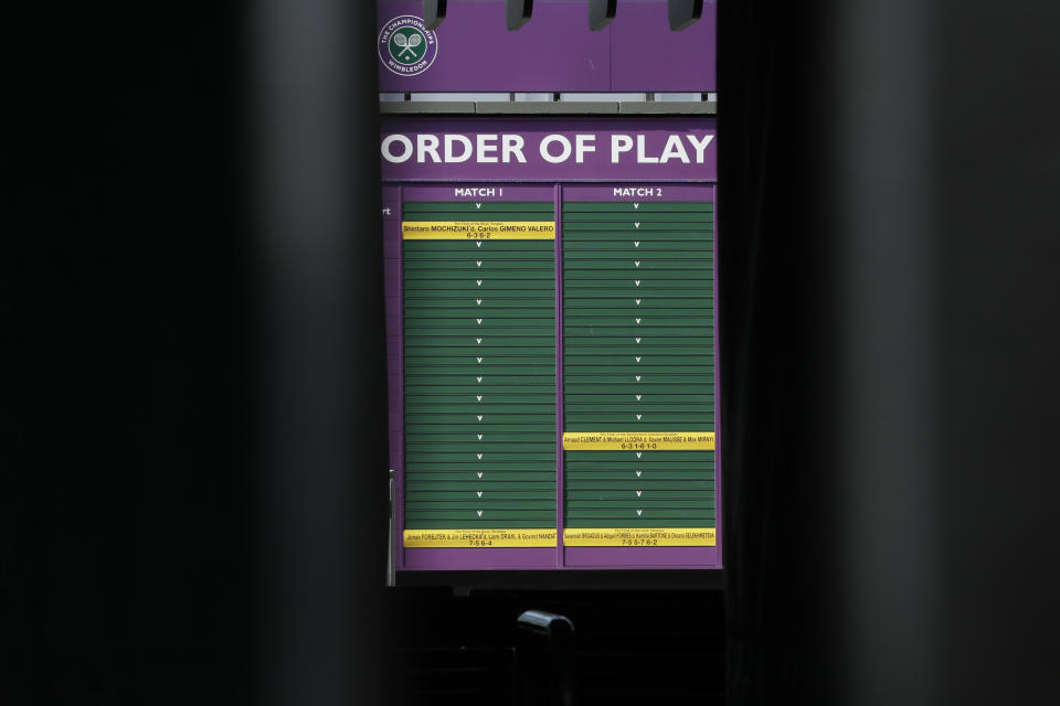 An order of play sign in the grounds of Wimbledon as it is announced that the Wimbledon tennis Championships 2020 has been cancelled due to public health concerns linked to the coronavirus, in London, Wednesday, April 1, 2020. The new coronavirus causes mild or moderate symptoms for most people, but for some, especially older adults and people with existing health problems, it can cause more severe illness or death.(AP Photo/Kirsty Wigglesworth)