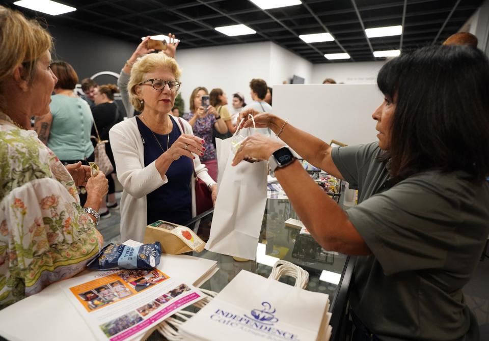 NY State Senator Shelley Mayer, center, makes a purchase at the new Girl AGain retail boutique at the Palisades Center Mall. Yes She Can, of Westchester and BRIDGES, Rockland County's independent living center, opens a branch of Girl AGain, a resale store for American Girl dolls at the Palisades Center Mall in West Nyack. Tuesday, August 29, 2023.