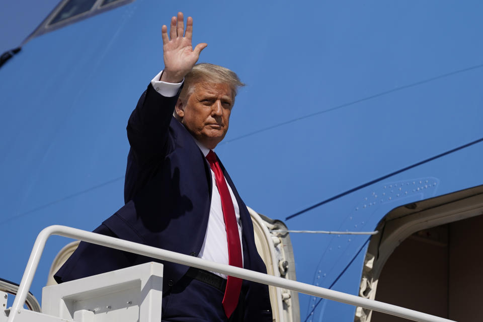 President Donald Trump waves while boarding Air Force One as he departs Wednesday, Sept. 30, 2020, at Andrews Air Force Base, Md. Trump is en route to Minnesota. (AP Photo/Alex Brandon)