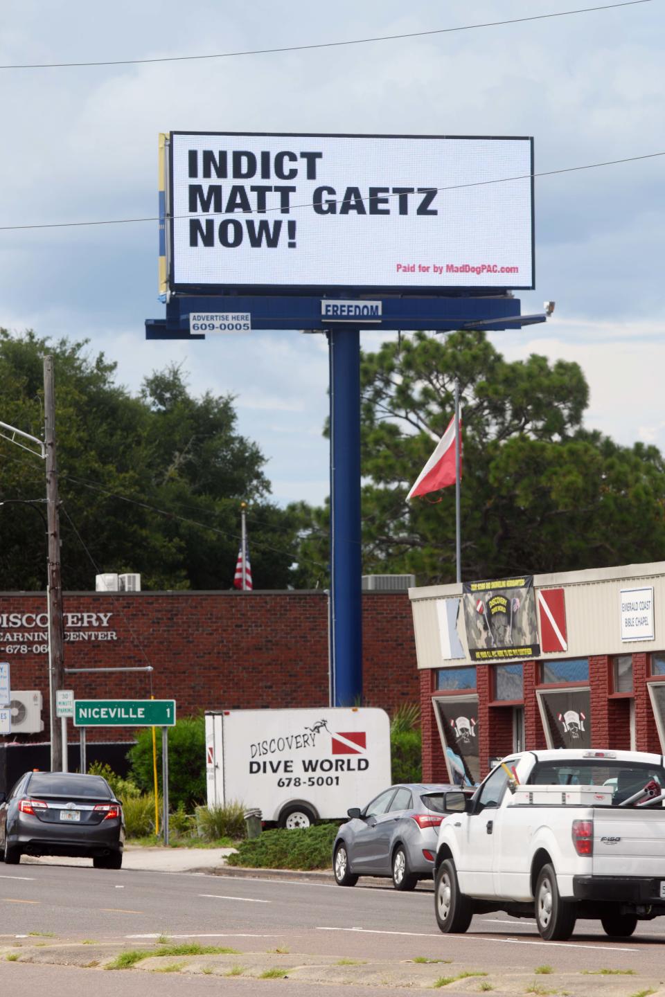 An electronic billboard reading "Indict Matt Gaetz Now!" stands on John Sims Parkway near the intersection of Valparaiso Boulevard in Valparaiso.