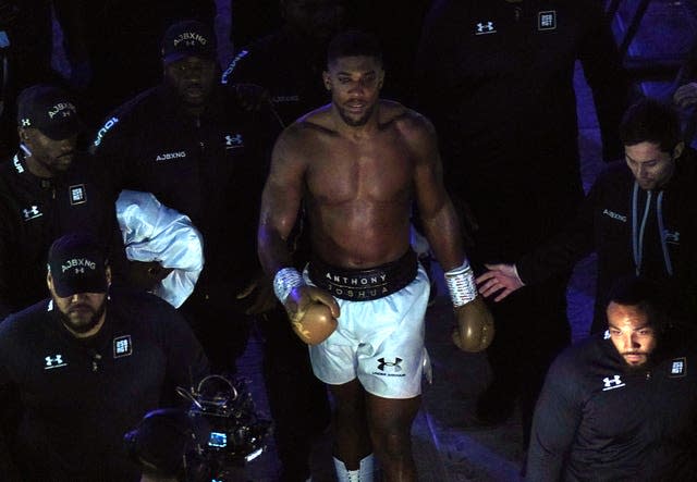 Anthony Joshua walks to his dressing room 