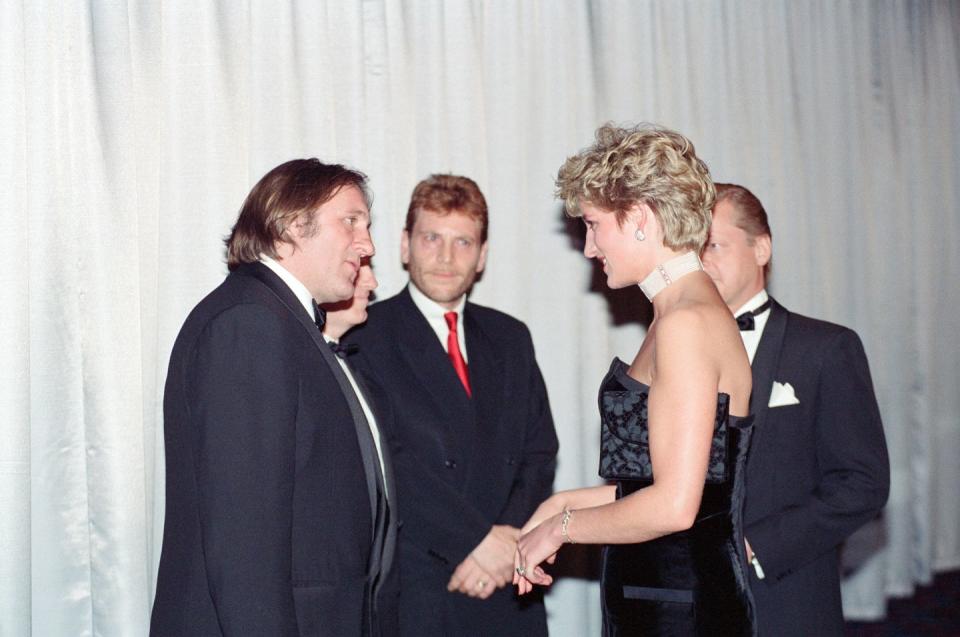 <p>The French actor bid adieu to Princess Diana as she made her way through the receiving line at the premiere of <em>1492. </em>He wore (you guessed it) a black tuxedo. She, on the other hand, chose a black strapless evening gown by Victor Edelstein. </p>