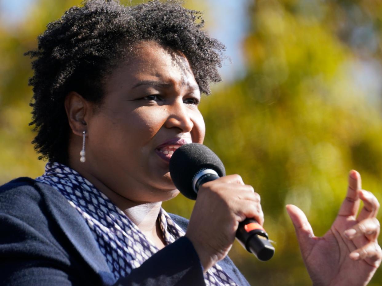 <p>Stacey Abrams speaks to Biden supporters as they wait for former President Barack Obama to arrive and speak at a rally as he campaigns for Democratic presidential candidate former Vice President Joe Biden at Turner Field in Atlanta</p> (AP)