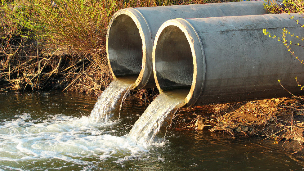 Pollution is dumped into a waterway