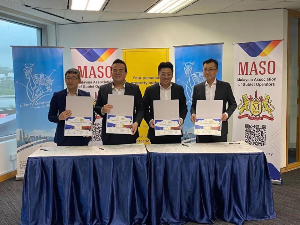 (From left) Maso vice president Eric Yap, Maso president Ken Lee, BlueDuck founder Earnest Wong, and Liberty Insurance head of commercial lines Foo Yong Chiat announce their partnership at an official ceremony. — Picture courtesy of BlueDuck