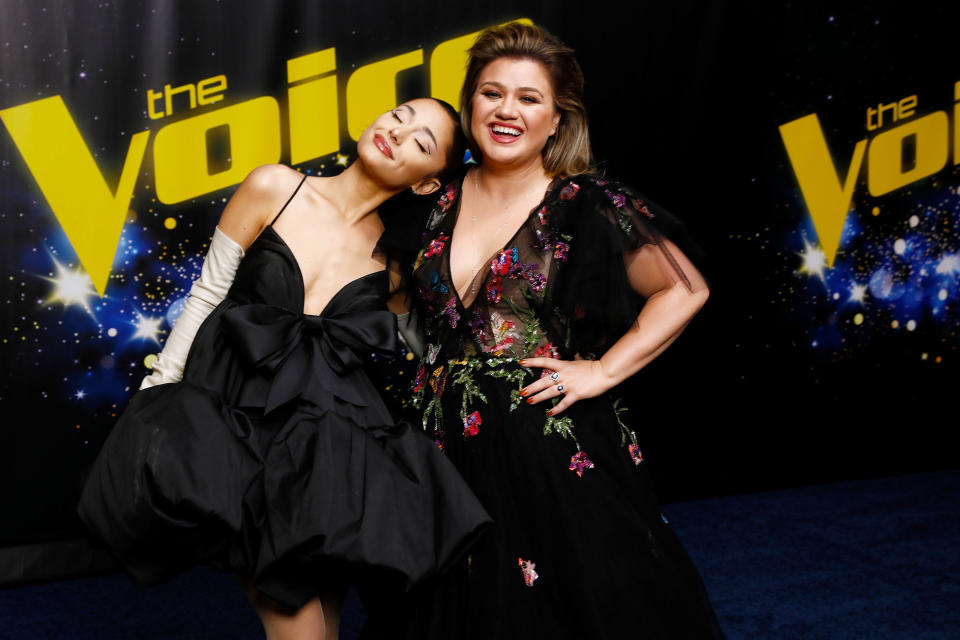<p><i>The Voice</i> coaches Ariana Grande and Kelly Clarkson are all smiles ahead of the Live Top 10 Performances on Nov. 29 in Hollywood. </p>