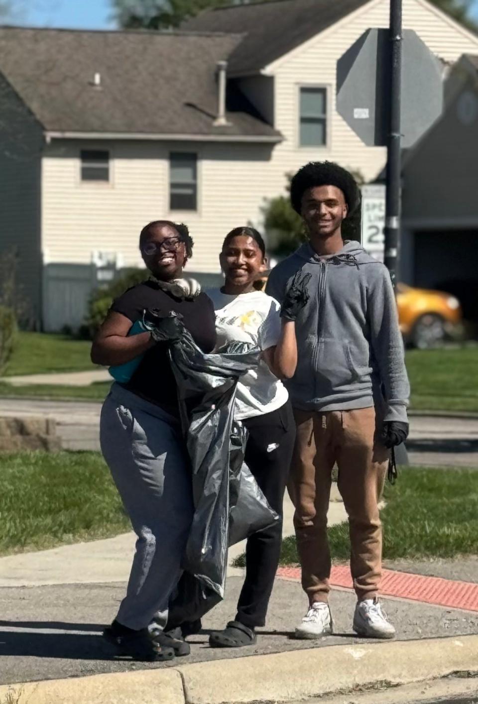 Natnaiel Ayele, right, with other Licking Heights students during a recent litter cleanup along Taylor Road in Pataskala. Ayele organized the cleanup through Licking Height's Cultural Identity Club.