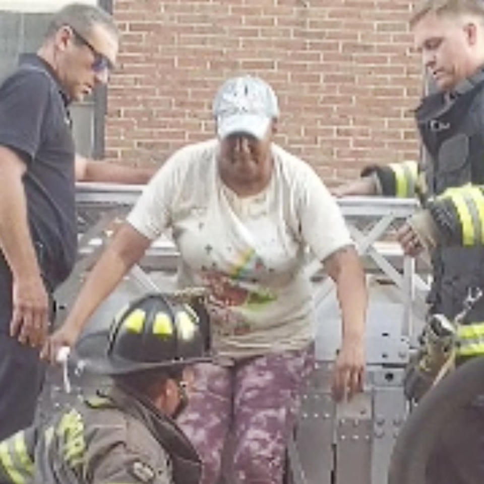 Lisa Brooks is rescued more than 24 hours after her apartment building in Davenport, Iowa, partially collapsed.  (Travis Vandivier)