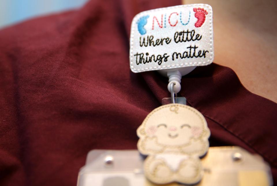 NICU nurse Stephanie Amundson's name badge clip reads “Where Little Things Matter."