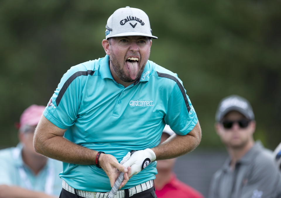 Robert Garrigus reacts to his tee shot on the 17th hole during the first round of the the Canadian Open golf tournament at Glen Abbey in Oakville, Ontario, Thursday, July 26, 2018. (Frank Gunn/The Canadian Press via AP)