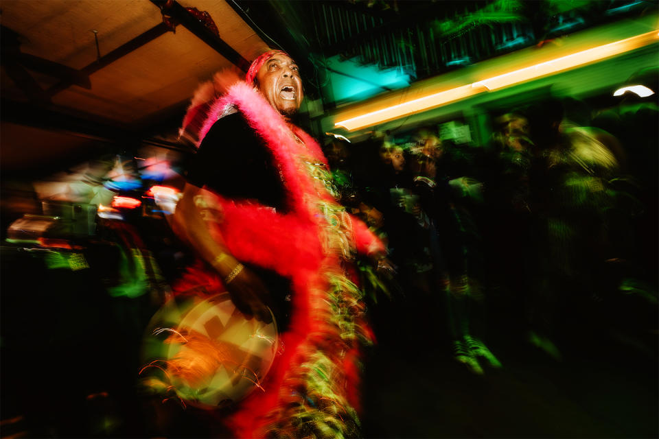 Charles DuVernary performing in the crowd alongside The Monogram Hunters.