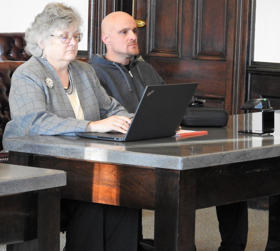 Attorney Marie Seiber with client David E. Smith Tuesday in Coshocton County Common Pleas Court. Smith received a mandatory minimum term of 7 years in prison for trafficking in methamphetamine, having weapons under disability and being in possession of a defaced firearm.