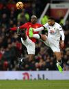 <p>United’s Paul Pogba (left) comes up against Etienne Capoue</p>