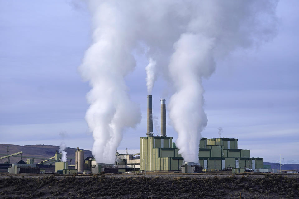 FILE - Steam billows from a coal-fired power plant Nov. 18, 2021, in Craig, Colo. The Supreme Court on Thursday, June 30, 2022, limited how the nation’s main anti-air pollution law can be used to reduce carbon dioxide emissions from power plants. By a 6-3 vote, with conservatives in the majority, the court said that the Clean Air Act does not give the Environmental Protection Agency broad authority to regulate greenhouse gas emissions from power plants that contribute to global warming. (AP Photo/Rick Bowmer, File)