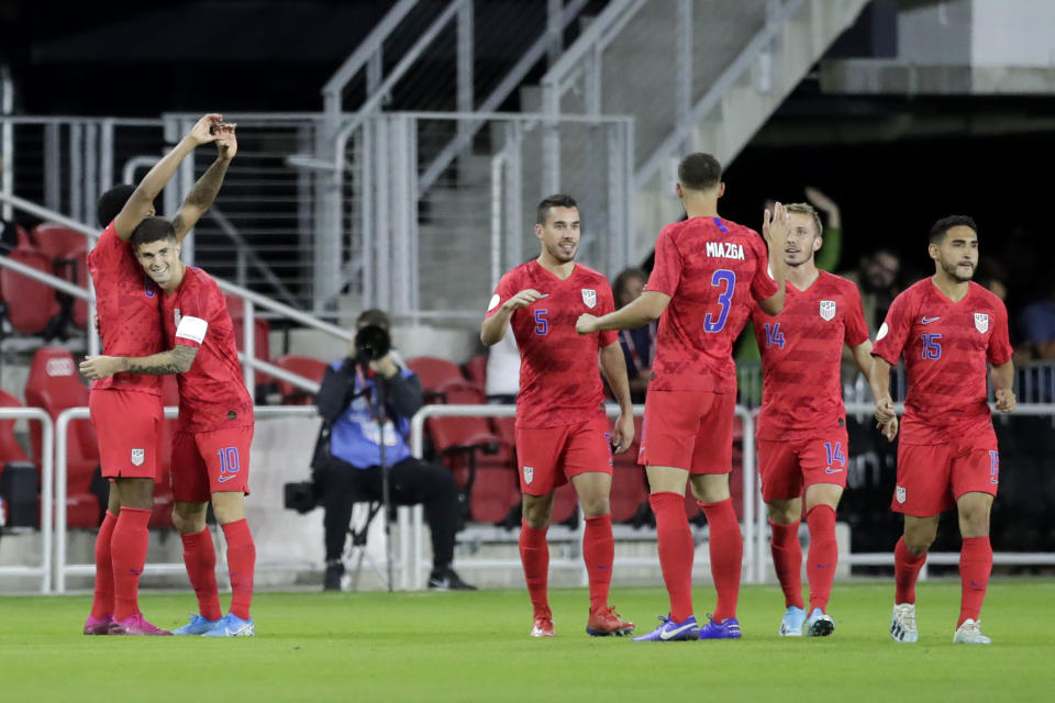 United States' Weston McKennie, left, is congratulated by Christian Pulisic (10) after scoring a goal on Cuba in the first minute of the first half of a CONCACAF Nations League soccer match Friday, Oct. 11, 2019, in Washington. (AP Photo/Julio Cortez)