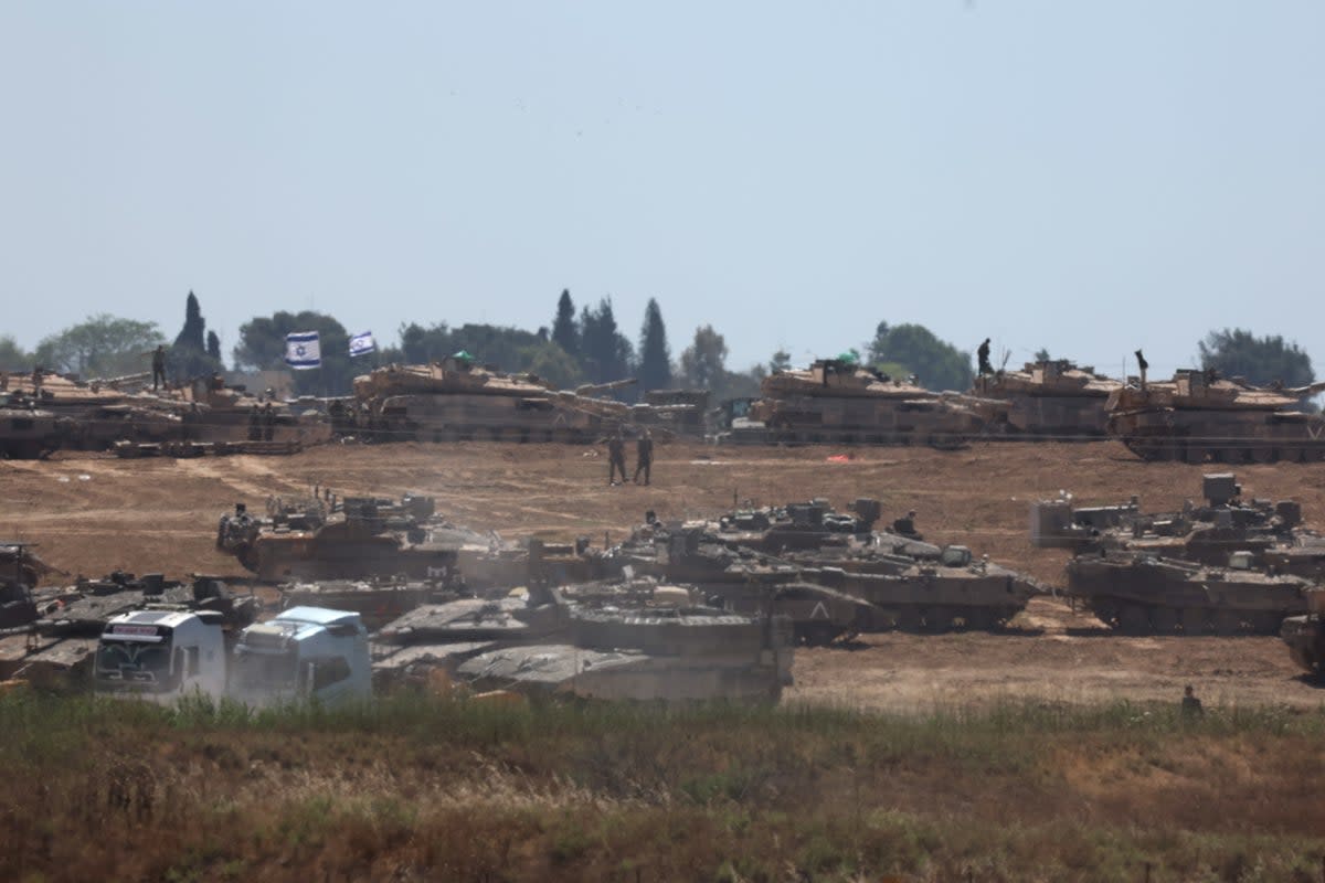 Israeli troops gather at an undisclosed location near the border with the Gaza Strip, in Israel (EPA)
