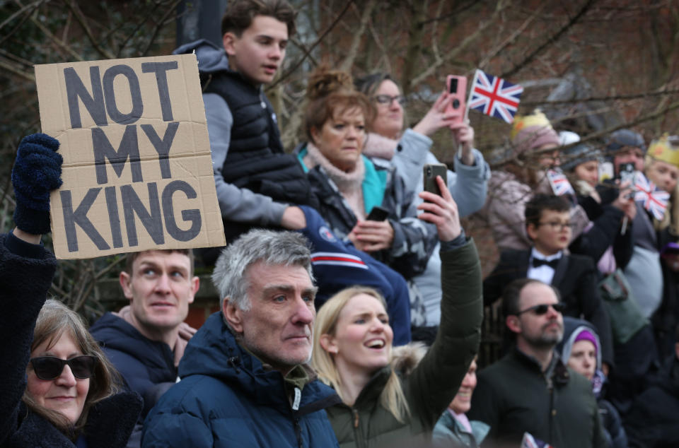 COLCHESTER, ENGLAND - MARCH 07: A Not My King protester joins crowds gathering to see King Charles III on March 7, 2023 in Colchester, England. (Photo by Martin Pope/Getty Images)