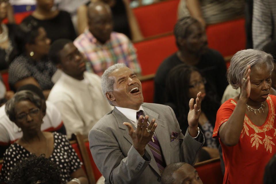 Parishioners attend a service after a gunman <a href="http://www.huffingtonpost.com/2015/06/17/charleston-shooting-churc_n_7608738.html">killed nine people</a>&nbsp;at a historic black church in Charleston, South Carolina, on June 17.&nbsp;Investigators found that the shooter, Dylann Roof, posted photos of himself wearing <a href="http://www.huffingtonpost.com/2015/06/18/dylann-roof-facebook-photo_n_7612708.html?1434644282">symbols of white supremacy</a>, including a&nbsp;Confederate flag,&nbsp;on social media.