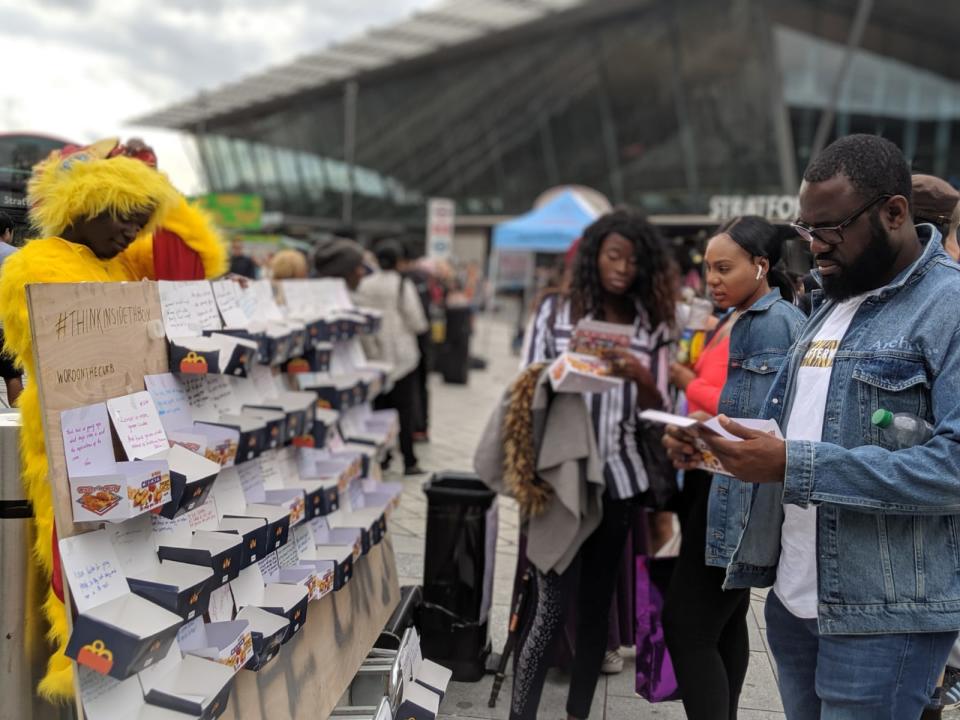 Londoners write messages for chicken boxes as part of Wartemberg and Uchea's #ThinkInsideTheBox campaign | Hayel Wartemberg