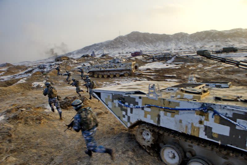 FILE PHOTO: Soldiers of the People's Liberation Army (PLA) Marine Corps are seen in training at a military training base in Bayingol