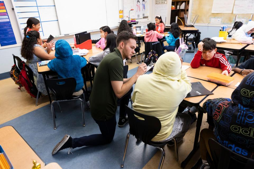 Teacher Rodney LaFleur quizzes his students on phonics skills at Nystrom Elementary in Richmond, Calif.