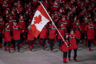 <p>Tessa Virtue carries the flag of Canada during the opening ceremony of the 2018 Winter Olympics in Pyeongchang, South Korea, Friday, Feb. 9, 2018. (Sean Haffey/Pool Photo via AP) </p>