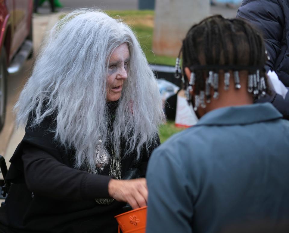 Karen Duck, dressed as Grandmama in The Addams Family, hands out candy at the 2021 Fall Festival of Treats at St. Luke's United Methodist Church-Edmond.
(Photo: DOUG HOKE/THE OKLAHOMAN)
