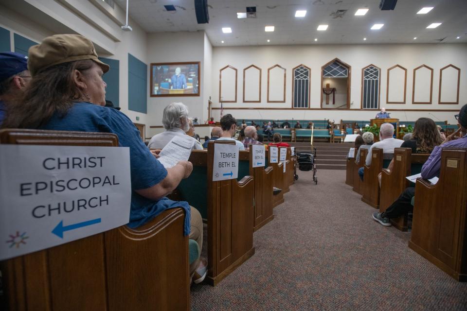 Participants listen as Gateway Church of Christ lead minister Jeremy Kughn speaks during JUST Pensacola's fourth annual Nehemiah Action Assembly at the First Baptist Church of Warrington on Monday, April 24, 2023.