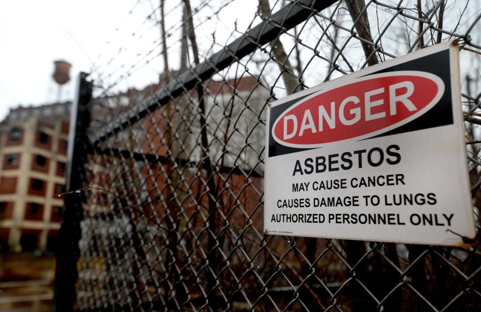 One of the many signs on the fence of the old Pillsbury Mills warning of the danger of going inside the fence Wednesday March 30, 2022. [Thomas J. Turney/ The State Journal-Register]
