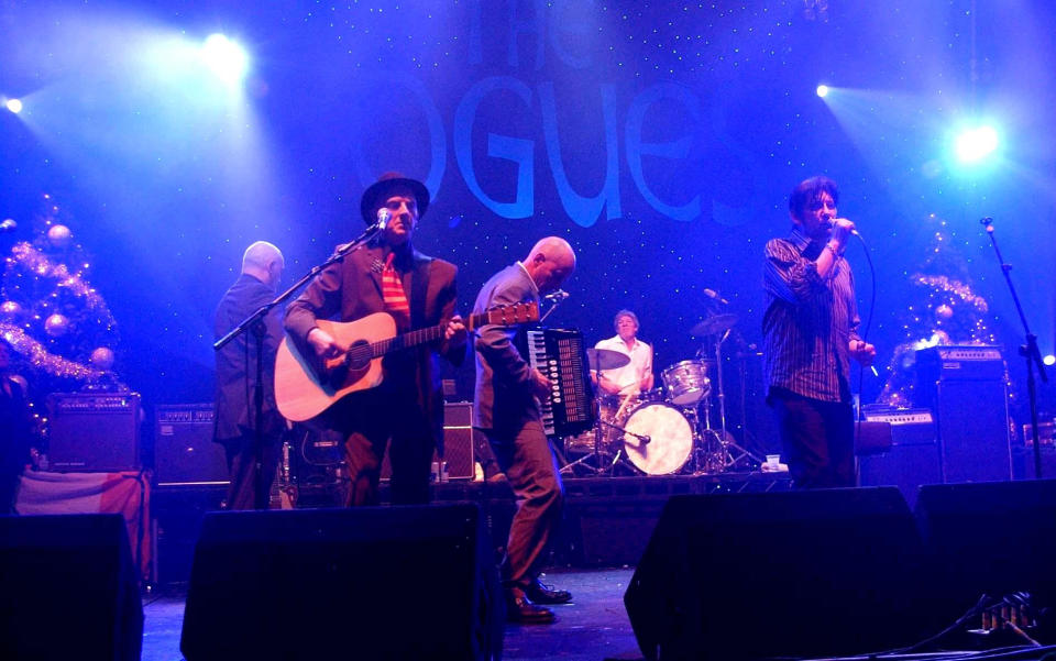 Shane MacGowan and The Pogues perform on stage at the Carling Academy, in Brixton, south London, Tuesday 20 December 2005. PRESS ASSOCIATION Photo. Photo credit should read: Joel Ryan/PA. Picture left is Philip Chevron.