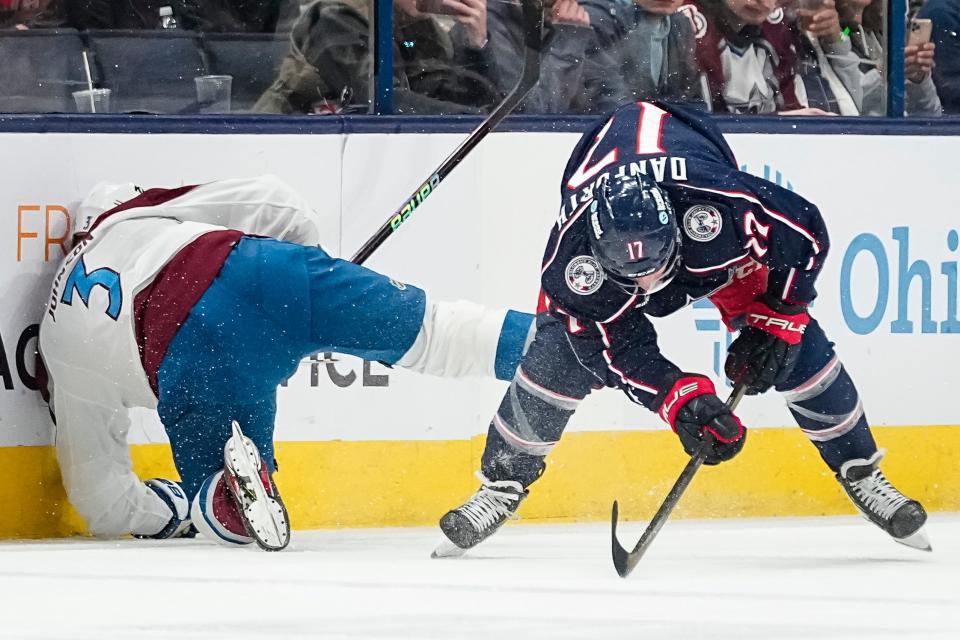 Apr 1, 2024; Columbus, Ohio, USA; Columbus Blue Jackets right wing Justin Danforth (17) collides with Colorado Avalanche defenseman Jack Johnson (3) during the first period of the NHL hockey game at Nationwide Arena.